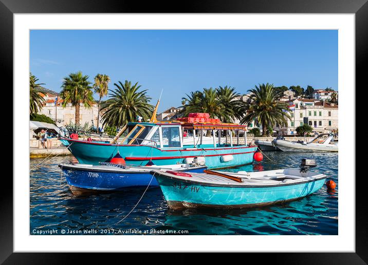 Colourful boats in Hvar Town Framed Mounted Print by Jason Wells
