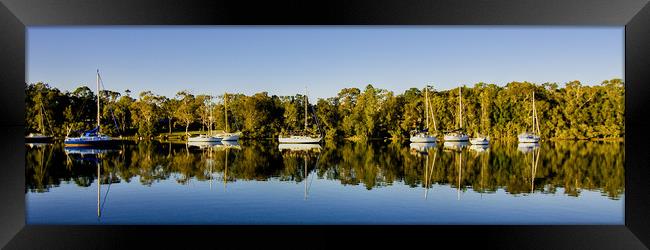 Lake landscape waterscape with boat reflections. Framed Print by Geoff Childs