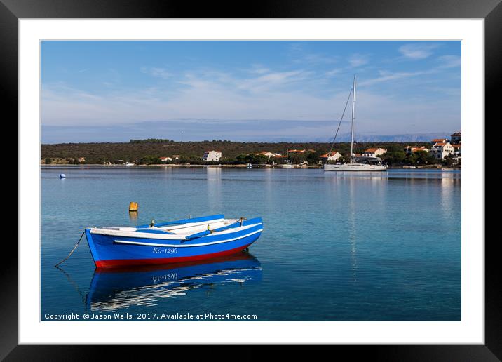 Reflections of a boat in Loviste Bay Framed Mounted Print by Jason Wells