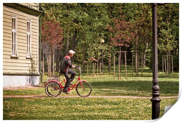 Park Worker Riding a Bike with a Rake Print by Jukka Heinovirta