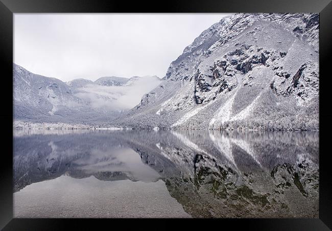 Icy mountain reflections Framed Print by Ian Middleton