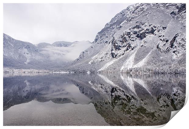 Icy mountain reflections Print by Ian Middleton