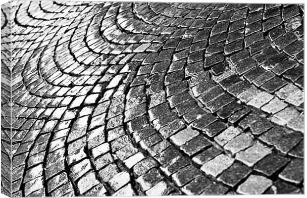 Cobblestone pavement after rain Canvas Print by Gabor Pozsgai
