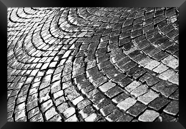 Cobblestone pavement after rain Framed Print by Gabor Pozsgai