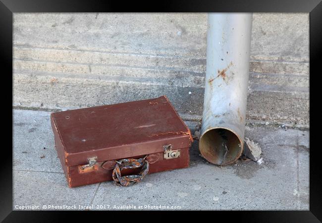 Old cardboard suitcase in the street Framed Print by PhotoStock Israel