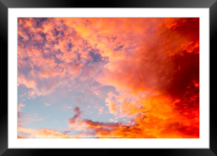 red cloudscape at sunset. Framed Mounted Print by PhotoStock Israel