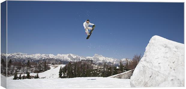 Snowboard jumper at Vogel Mountain, Slovenia Canvas Print by Ian Middleton