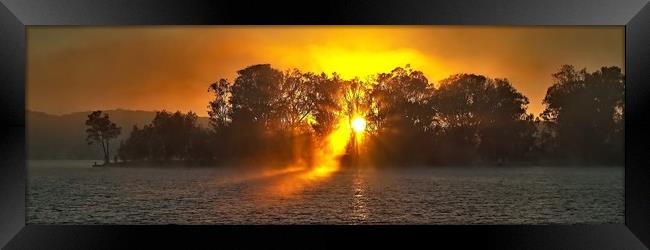 Misty Sunrise Through Trees.  Framed Print by Geoff Childs