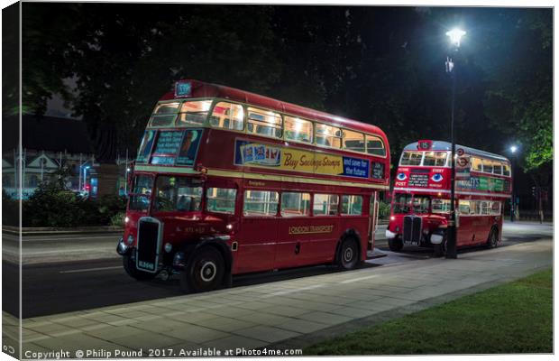 Two Veteran London Double Decker Red Buses at Nigh Canvas Print by Philip Pound