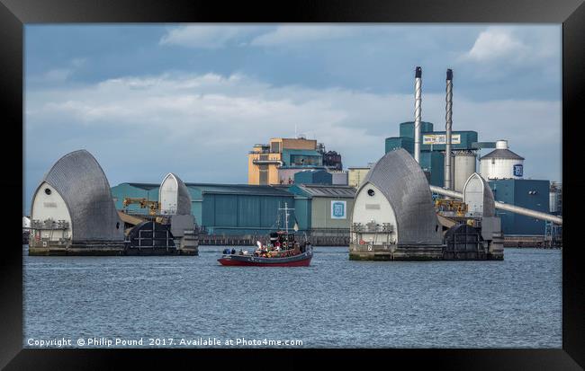 Tug passing through Thames Barrier at Woolwich Framed Print by Philip Pound