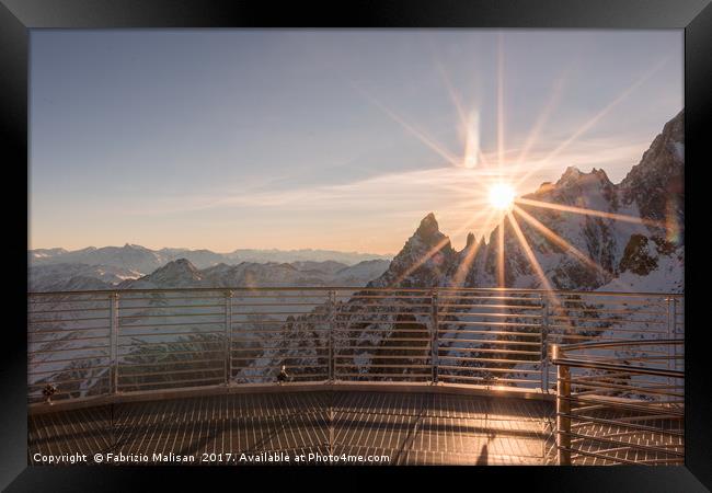 The sun sets behind the mountains Framed Print by Fabrizio Malisan