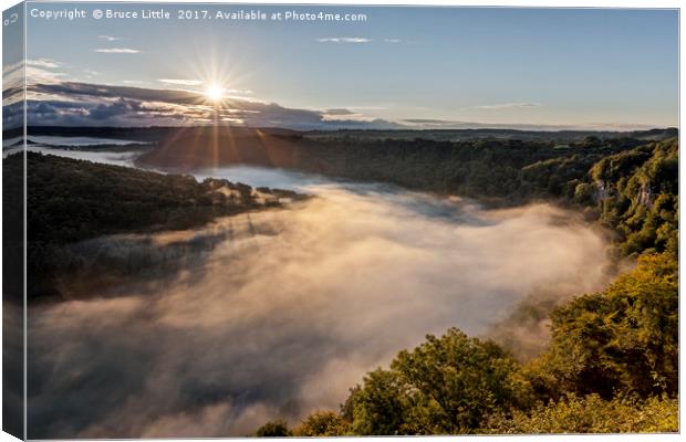 Majestic Sunrise over Mystical Fog Canvas Print by Bruce Little