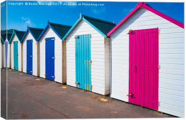 Colorful wooden beach huts Canvas Print by Beata Aldridge