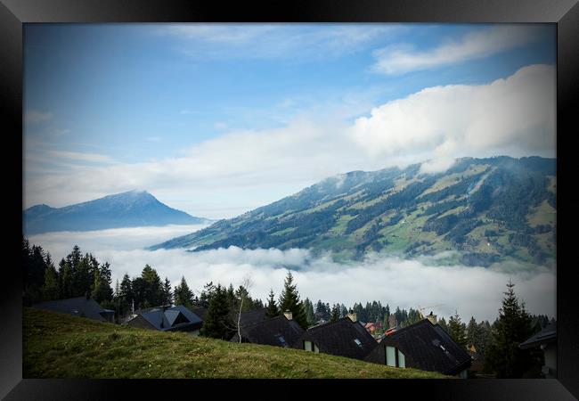 Switzerland Mountains with low cloud Framed Print by Darren Willmin