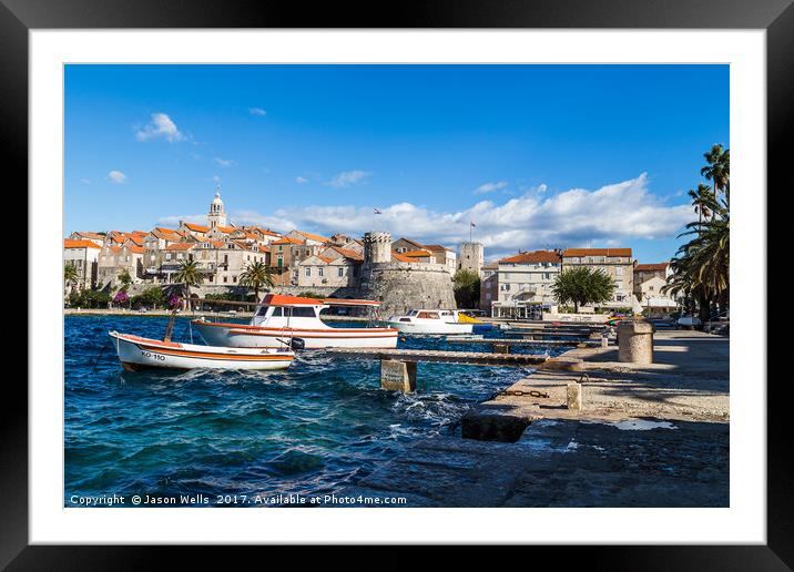 Boats bob on the choppy waters by Korcula old town Framed Mounted Print by Jason Wells