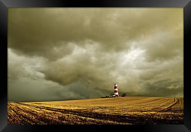 Happisburgh Lighthouse amongst the Clouds Framed Print by Paul Macro