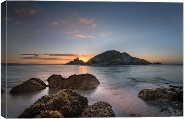 Sunrise at Mumbles lighthouse. Canvas Print by Bryn Morgan