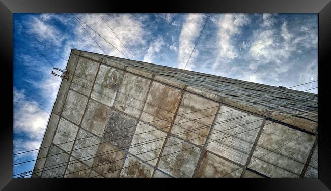 Sinking Building Sky of Dread Framed Print by John Williams
