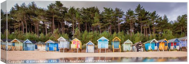 Beach hut row on the Norfolk coast Canvas Print by Simon Bratt LRPS