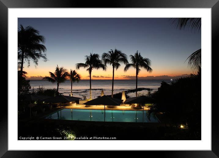 Mauritian sunset by the pool lined with palm trees Framed Mounted Print by Carmen Green
