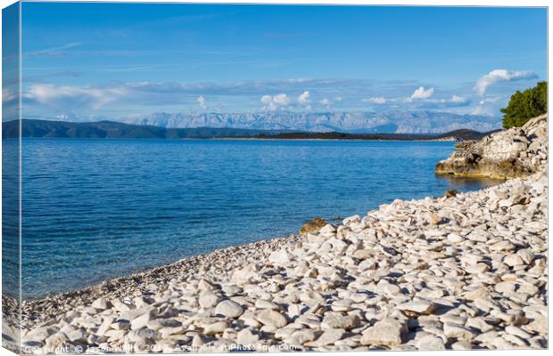 Overlooking the pebbles of Vaja Bay Canvas Print by Jason Wells