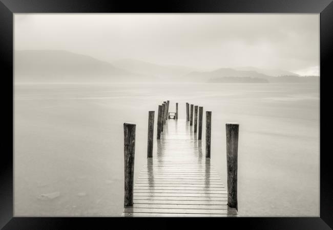Ashness jetty in the pouring rain Framed Print by Peter Scott