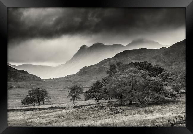 Langdale Pike vs the storm Framed Print by Peter Scott