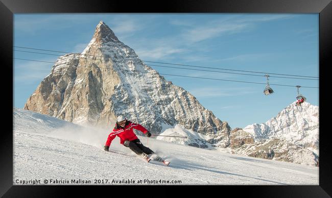 Skiing by the Matterhorn Mountain in Zermatt Framed Print by Fabrizio Malisan