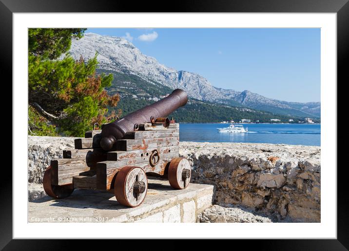Cannon looks out down the Peljesac Channel Framed Mounted Print by Jason Wells
