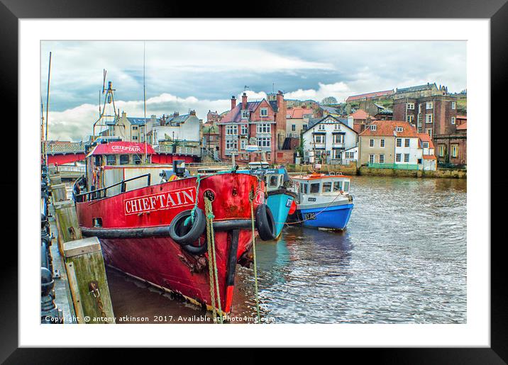walking along Whitby Harbour Framed Mounted Print by Antony Atkinson