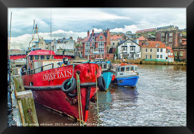 walking along Whitby Harbour Framed Print by Antony Atkinson