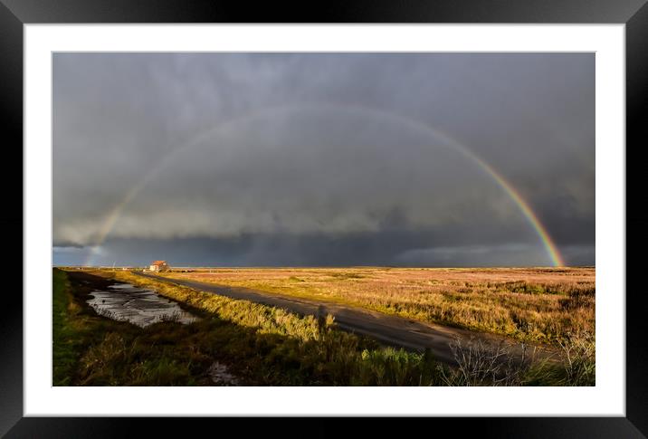 A rainbow over the old coal barn at Thornham Framed Mounted Print by Gary Pearson