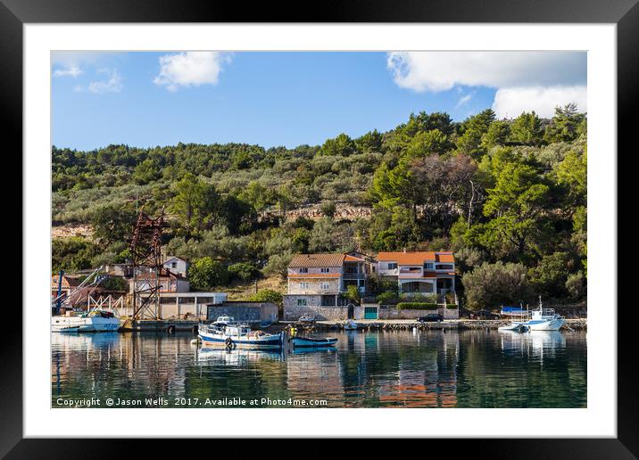 Green trees and shrubs behind Vela Luka harbour Framed Mounted Print by Jason Wells