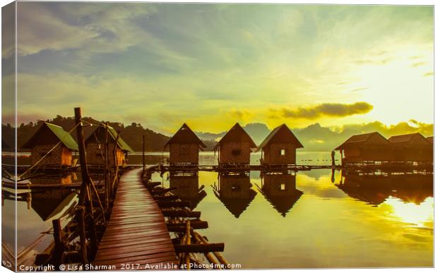 Sunrise over lake huts Canvas Print by  