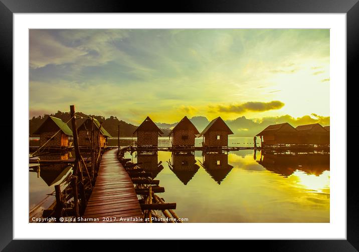 Sunrise over lake huts Framed Mounted Print by  