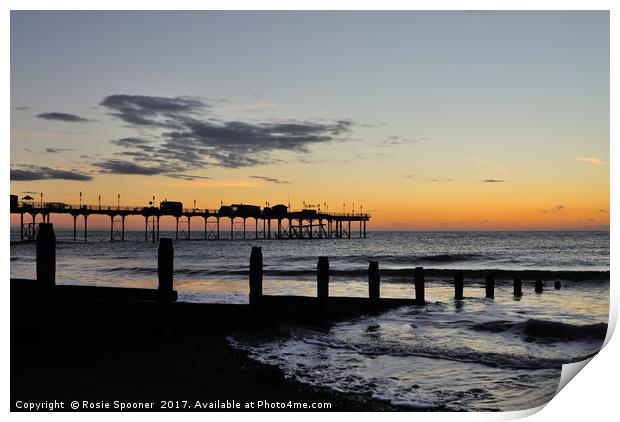 Silhouetted sunrise  of Teignmouth Pier and Groyne Print by Rosie Spooner