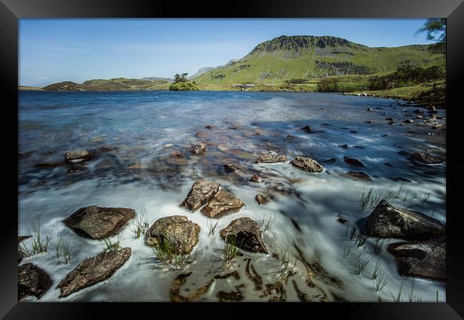 Rocks on the shore of Llynnau Cregennen lake Framed Print by Tom Radford