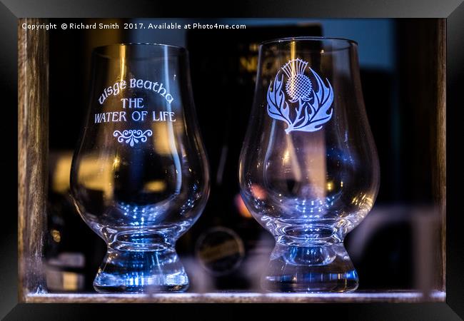 Whisky glasses in a Portree shop window Framed Print by Richard Smith