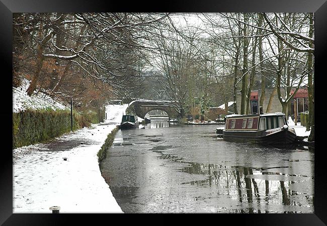 Narrowboat on the icy canal at Uppermill Framed Print by JEAN FITZHUGH