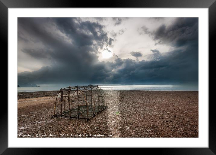 Fish trap on stony beach Framed Mounted Print by Kevin Hellon