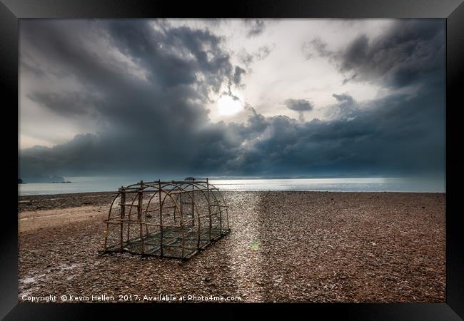 Fish trap on stony beach Framed Print by Kevin Hellon