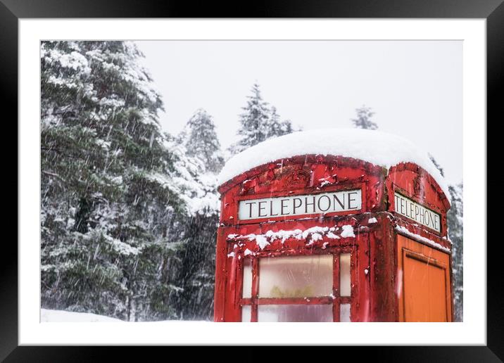 A British Red telephone box covered in snow Framed Mounted Print by Tom Radford