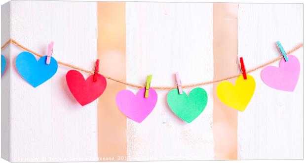Multicolored hearts tied on a string Canvas Print by Daniela Simona Temneanu
