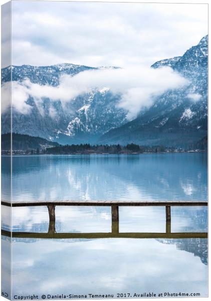 Alps mountains reflected in water Canvas Print by Daniela Simona Temneanu