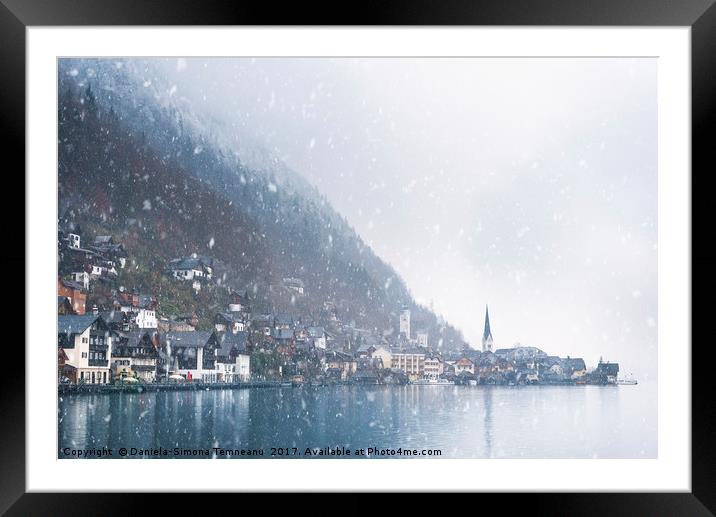 Austrian mountain town under snowfall Framed Mounted Print by Daniela Simona Temneanu