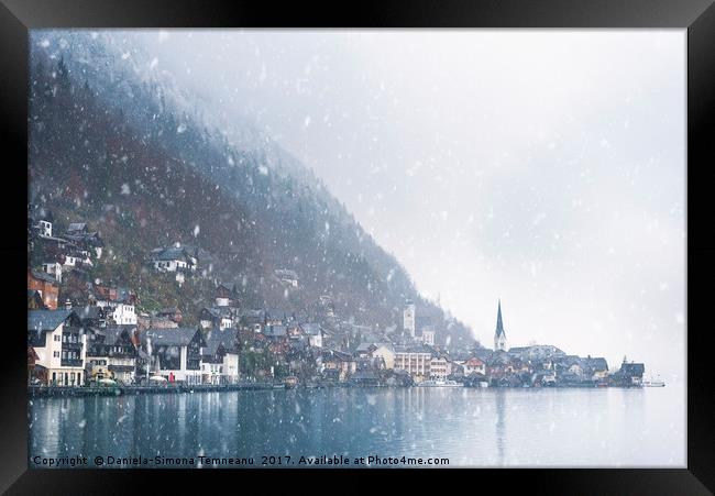 Austrian mountain town under snowfall Framed Print by Daniela Simona Temneanu