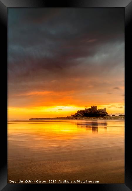 Bamburgh Castle Sunrise Framed Print by John Carson