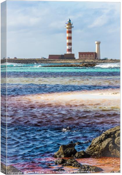 Lighthouse and Stripy Seascape Canvas Print by John Parker