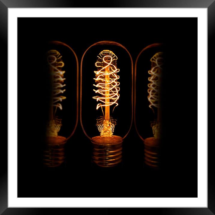 Edison bulb alight Framed Mounted Print by Donnie Canning