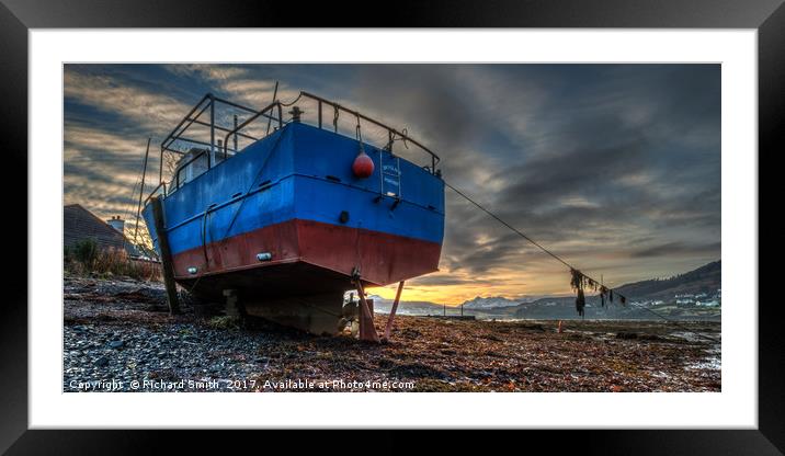 Sunrise colour beyond a beached vessel. Framed Mounted Print by Richard Smith